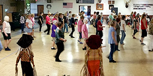 dance lessons raise money fundraising group organizing line dancing event